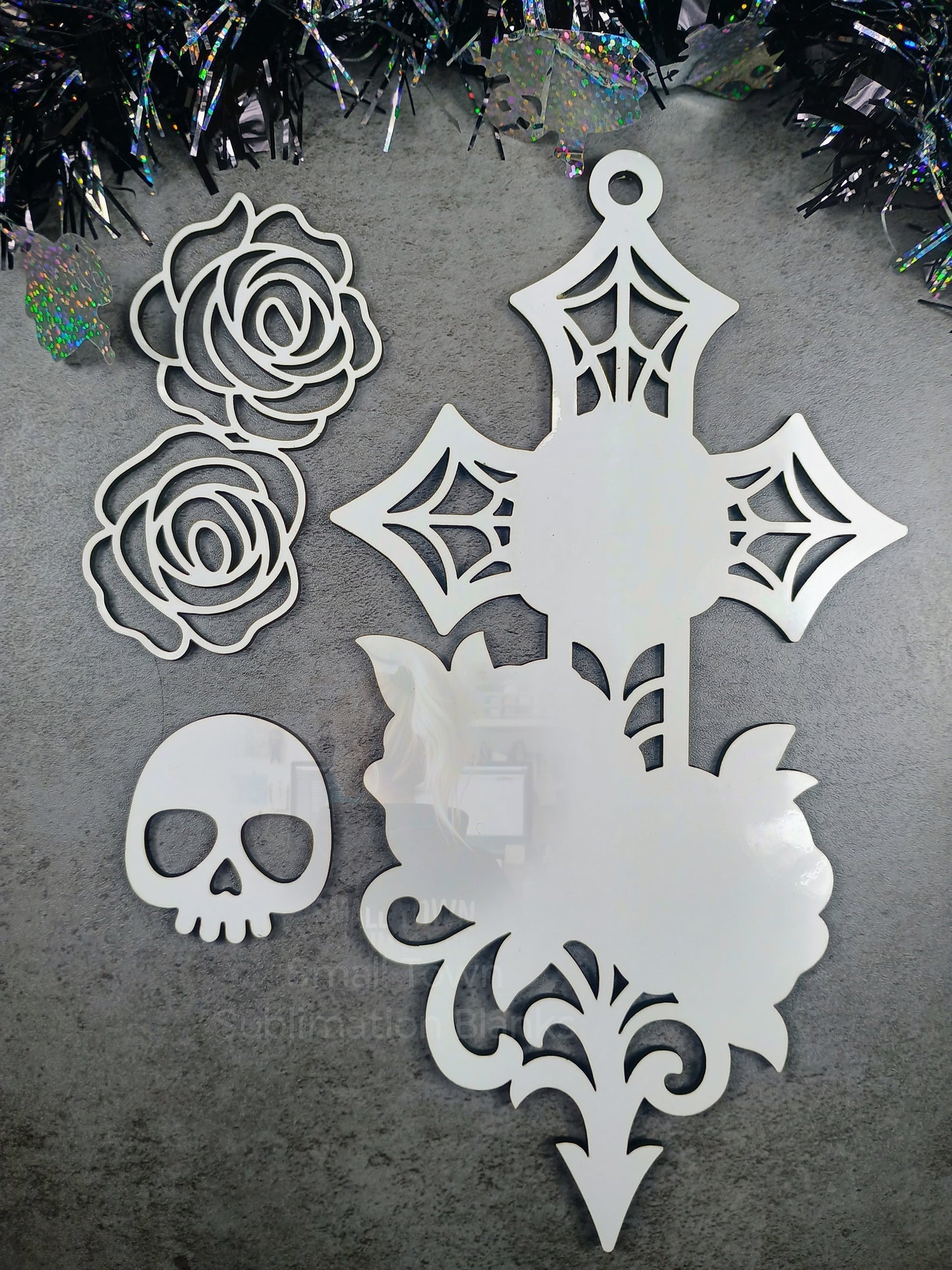 Skull cross window hanger