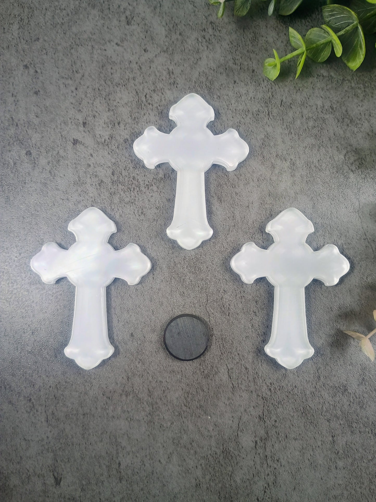Set of Cross clear acrylic magnets.